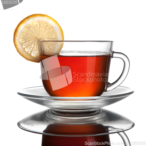 Image of cup of tea with lemon isolated on white