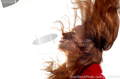 Image of young girl with hair in motion