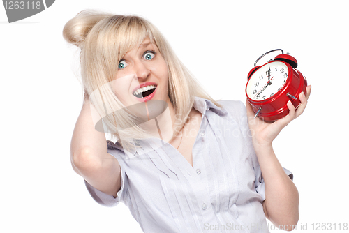Image of Shocked beautiful young woman with alarm clock isolated on white