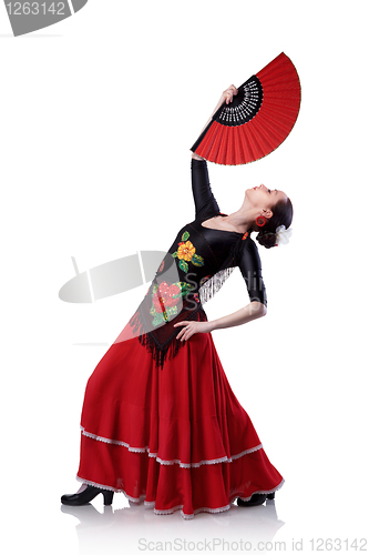 Image of young woman dancing flamenco with fan isolated on white