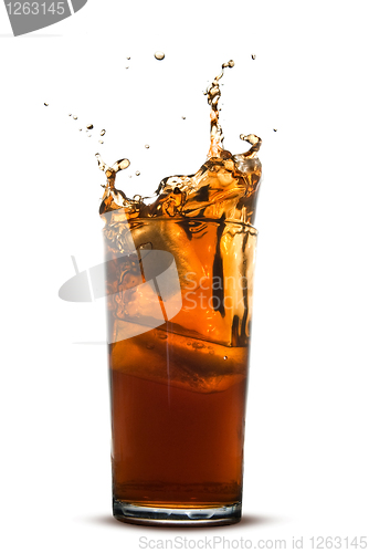 Image of Beautiful splash of cola in glass isolated on white