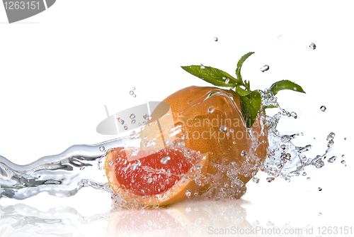 Image of Water splash on grapefruit with mint isolated on white