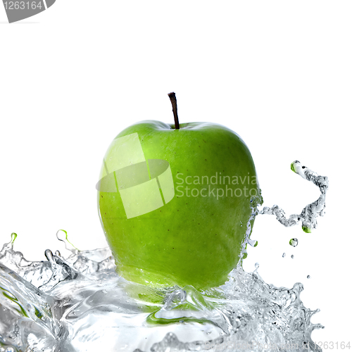 Image of fresh water splash on green apple isolated on white