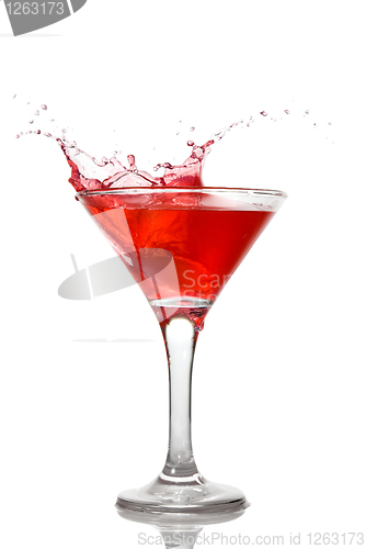 Image of Red cocktail with splash isolated on white