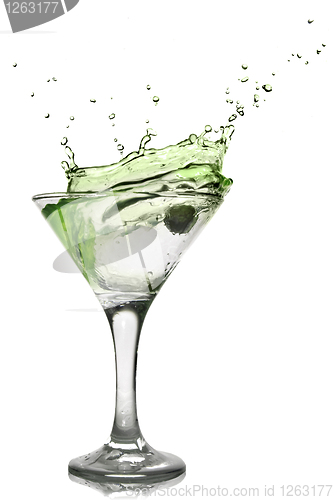 Image of Green alcohol cocktail with splash isolated on white