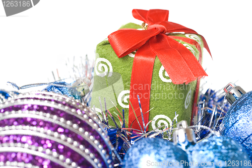 Image of christmas balls with and gift with decoration isolated on white