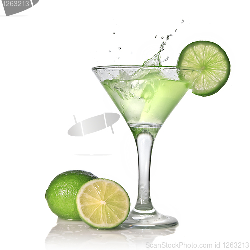 Image of Green alcohol cocktail with splash and green lime isolated on wh