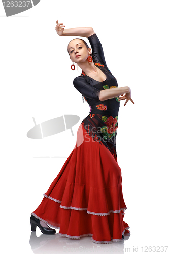 Image of young woman dancing flamenco with castanets isolated on white