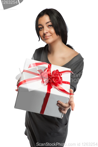 Image of Young smiling woman holding gift isolated on white
