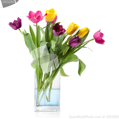 Image of bouquet from tulips in glass vase isolated on white