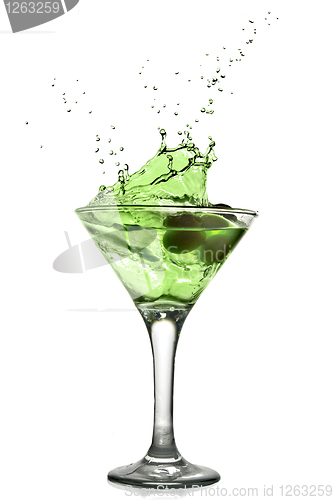 Image of Green alcohol cocktail with splash isolated on white