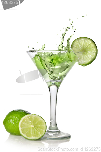 Image of Green alchohol cocktail with splash and green lime isolated on w