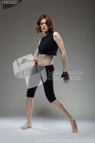 Image of attractive young woman dancing