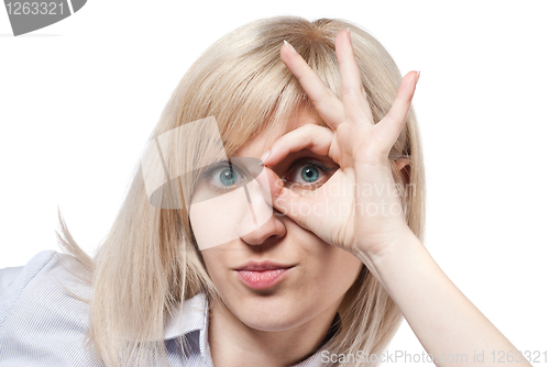 Image of Attractive young woman and Ok sign isolated on white