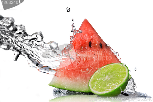 Image of watermelon, lime and water splash isolated on white