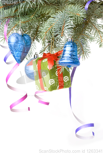 Image of Christmas balls, gift and decoration on fir tree branch isolated