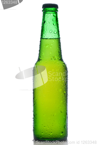 Image of Green beer bottle with water drops isolated on white