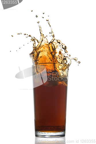 Image of Beautiful splash of cola in glass isolated on white