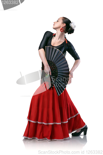 Image of young woman dancing flamenco with fan isolated on white