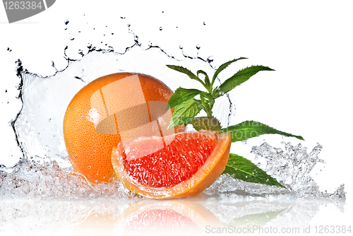 Image of Water splash on grapefruit with mint isolated on white