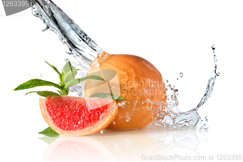 Image of Water splash on grapefruit with mint isolated on white