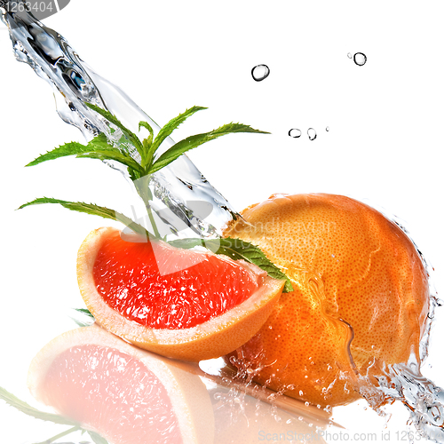 Image of Water splash on grapefruit with mint isolated on white