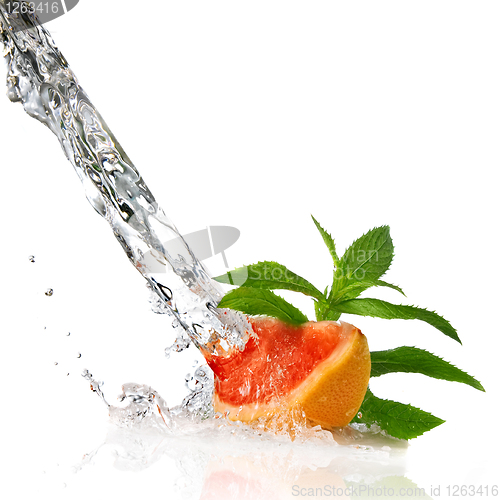 Image of Water splash on grapefruit with mint isolated on white