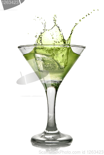 Image of Green alcohol cocktail with splash isolated on white