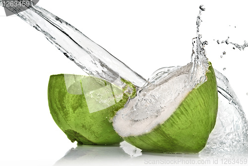 Image of Green coconut with water splash isolated on white