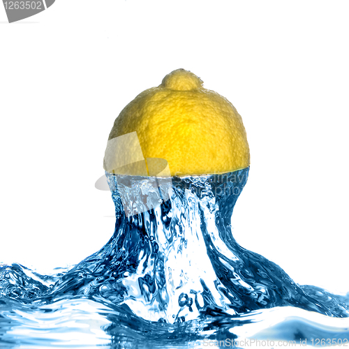 Image of Fresh lemon dropped into water with splash isolated on white