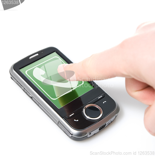 Image of finger and pda with incoming call isolated on white