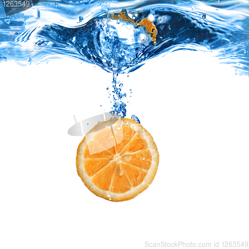 Image of Fresh orange dropped into water with bubbles isolated on white