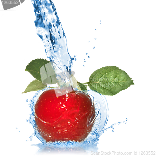 Image of red apple with leaves and water splash isolated on white 