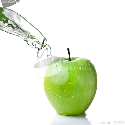 Image of fresh water splash on green apple isolated on white