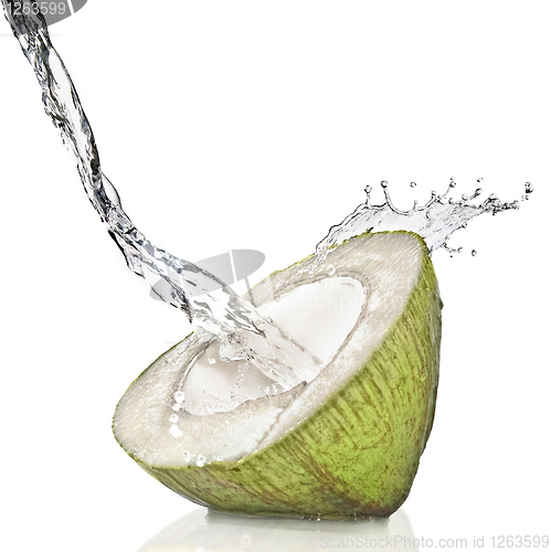 Image of fresh cut green coconut on white splashing