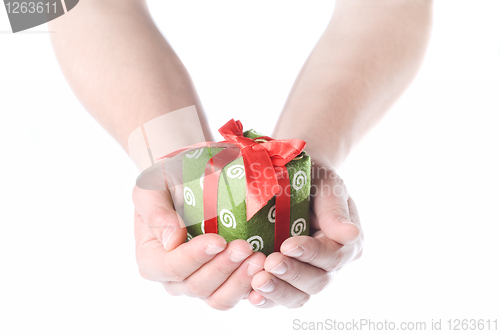 Image of Hands holding gift isolated on white