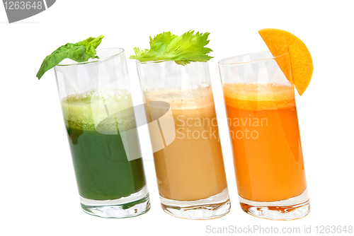 Image of fresh juices from carrot, celery and parsley in glasses isolated