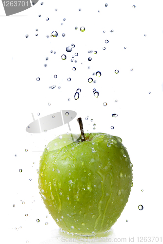 Image of fresh water drops on green apple isolated on white