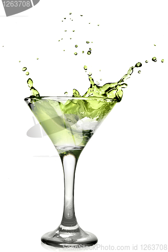 Image of Green alcohol cocktail with splash isolated on white