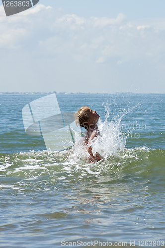 Image of boy playing in the sea