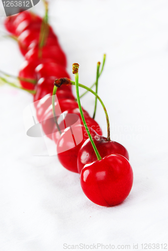 Image of Appetizing red cherries row