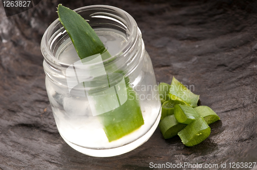 Image of aloe vera juice with fresh leaves