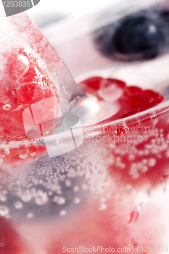 Image of Raspberry and blackberry frozen in ice sticks