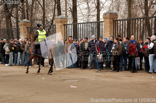 Image of Mounted Policewoman and Soccer Fans