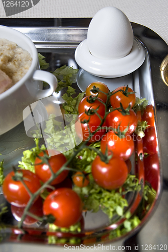 Image of Cluse up english breakfast with egg in focus