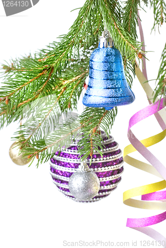 Image of Christmas balls and decoration on fir tree branch isolated on wh