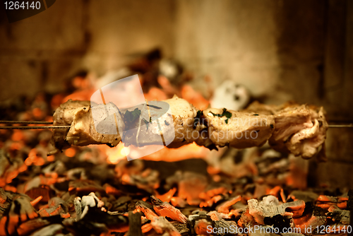 Image of fried meat on fire