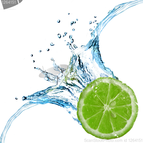 Image of Fresh lime dropped into water with splash isolated on white