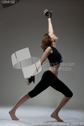 Image of attractive young woman dancing