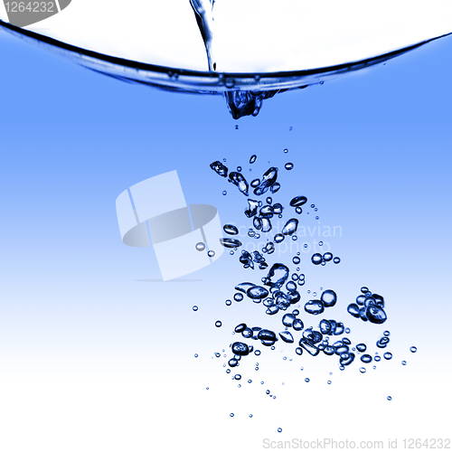 Image of water splash with bubbles isolated on white